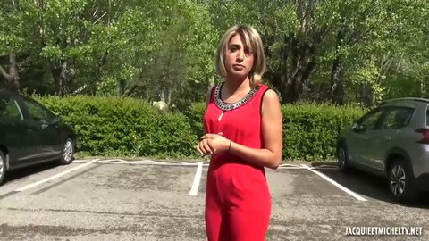 Assia in red dress, outdoor parking lot scene from Jacquie Et Michel