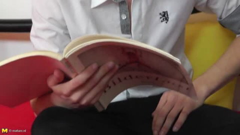 Birgita (52) mature MILF reading book with hairy pussy exposed