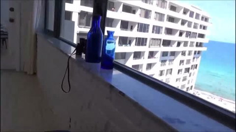 Audrey Miles in hotel window during spring break family video
