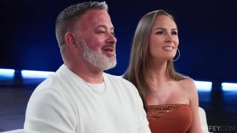 Hotwife Hannah in orange top next to mature man in white shirt