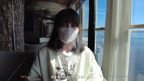 Hong Kong Doll in mask and cream sweater on ferry