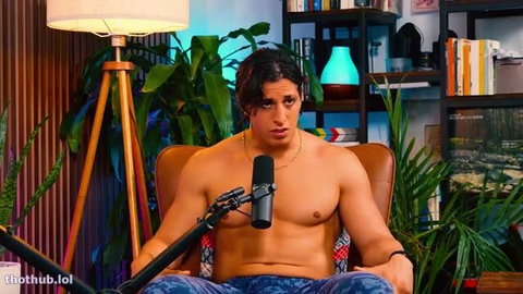 Shirtless muscular man with long dark hair on Pillow Talk podcast