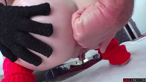 Juniper Ren close-up anal fingering with black glove and red sleeve