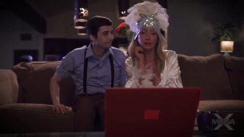 Sadie Summers in white lingerie and feather crown watching laptop with man