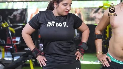 Curvy Indian wife in gym with shirtless male trainer