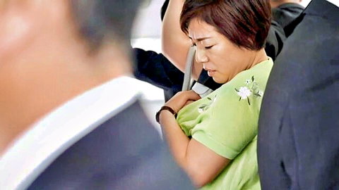 Mature Asian wife groped on crowded train by suited men