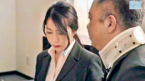 Japanese office lady in suit with older man in neck brace