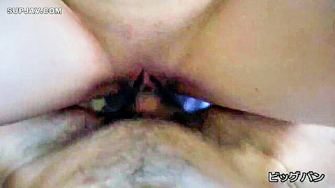 Uncensored close-up of Asian amateur's hairy pussy spread with blue toy