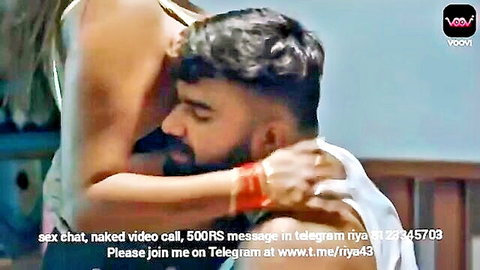 Busty Indian woman intimately embraces bearded man from behind