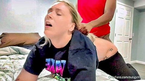 Blonde babe in doggy style on bed with black guy pulling her ponytail exposing big tattooed ass.