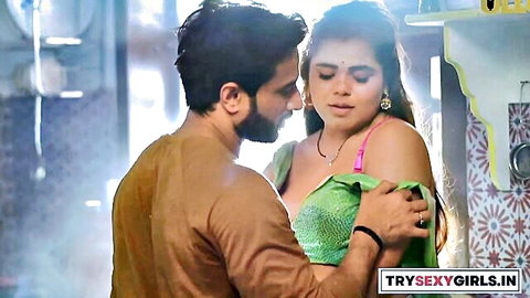 Indian man passionately kissing sexy wife's neck while groping her big tits in green blouse