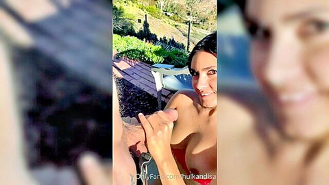 Topless smiling Latina babe with big tits groped by hand outdoors in public park