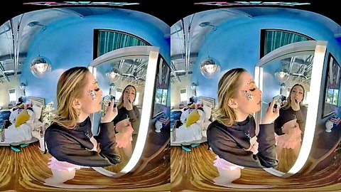 Blonde babe in black sweater and pink tutu applying glittery makeup in mirror VR view