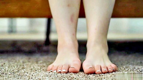 Minxx Marii sexy bare feet close-up with white toenails