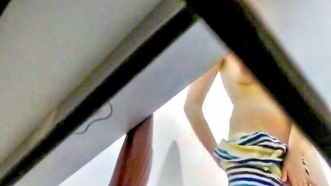 Dune topless in pool cabin, pulling striped swimsuit bottoms