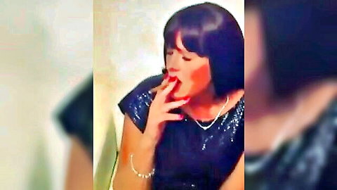 Alexia in sexy black dress inhaling cigar seductively
