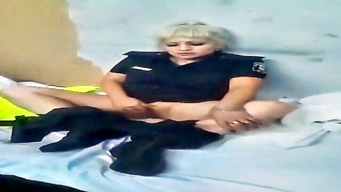 Blonde police officer in uniform masturbating solo on bed