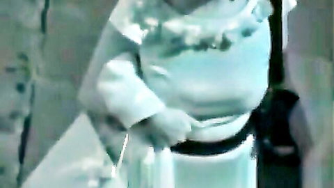 Woman in frilly white dress with oops nipple slip moment