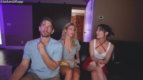 Threesome With LillyyLuna: man and two women on couch in seductive poses