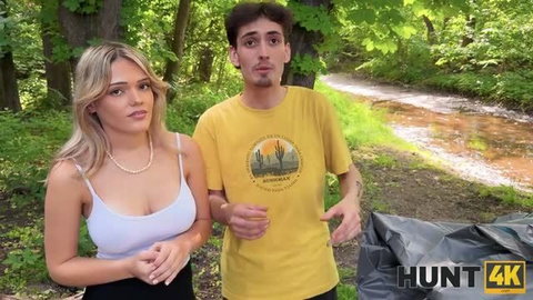 Jade Jadore in white tank top with Hunt4K outdoors in forest