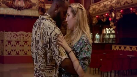 Sylvan Garcia in close intimate embrace with man in patterned shirt, blind date scene