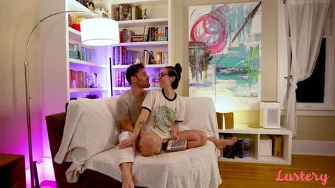 Tabby and NoName making out on couch in cozy lit room