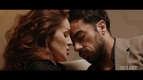 Luna Roulette redhead actress in intimate close-up with male co-star