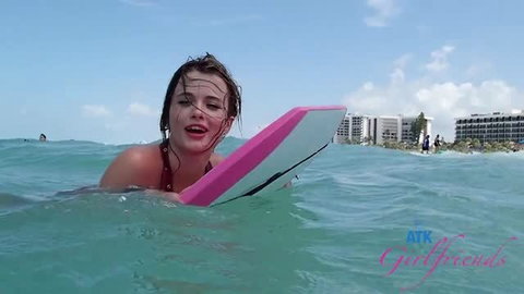 Nicole Nichols topless in ocean with boogie board, wet body POV