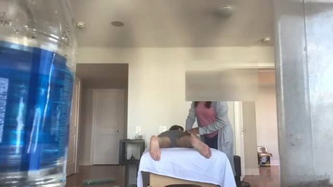 Ebony RMT massages male client on table, first appointment