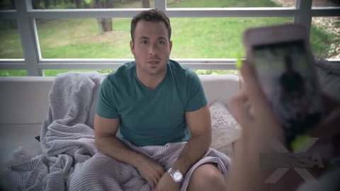 Jill Kassidy filming man on couch in Watching Porn with Jill MissaX video