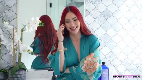 MillionDollarCussy in green silk robe smiling at camera