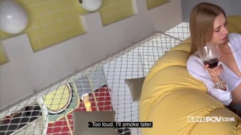 Californiababe relaxing with wine in yellow beanbag chair