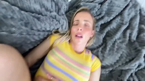 Khloe Monroe in yellow striped top with eyes closed, mouth open