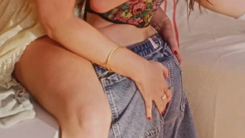 Lana Smalls and Lilly Bell in sensual lesbian embrace, denim and crop top