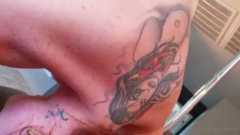 Abigaiil Morris tattoo close-up showing heart knuckles and flaming skull design