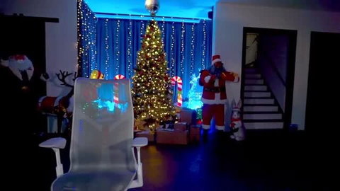 Amouranth in sexy Santa costume with clear inflatable chair holiday livestream thumbnail