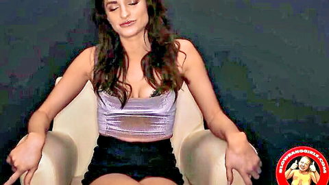 Skinny brunette teen with small tits in sheer silver top and tiny black shorts teasing legs apart on chair