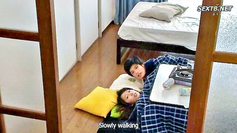 Mizuki Yayoi lying asleep next to man under blanket in JAV scene