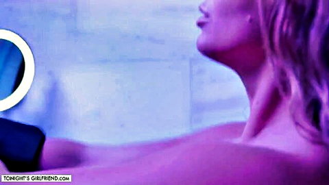 Kayley Gunner topless in seductive tub pose, busty blonde MILF