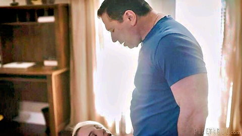 Blonde Kenna James in intimate daddy scene, eyes closed ecstasy, muscular man above