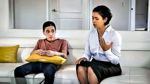 Dana Vespoli gestures to surprised stepson Juan Loco on couch