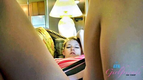 Melody Marks lies bottomless with sexy feet exposed on couch