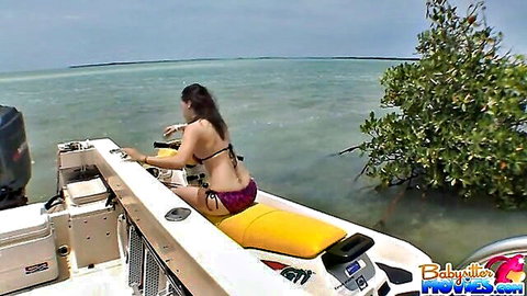Kandi Milan in revealing bikini on boat amid tropical waters