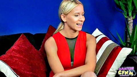 Kiara Lord blonde beauty smiling in sexy red mesh dress