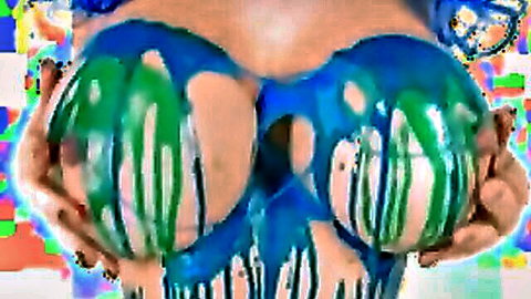 Skinny girl's bare small tits painted as skull with blue and green slime dripping, hands squeezing
