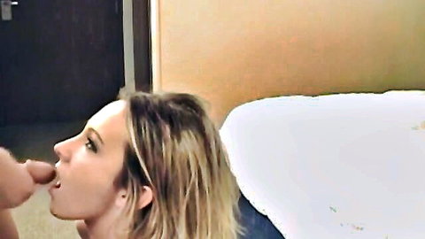 Man fingers blonde woman's parted lips and tongue in closeup bedroom foreplay