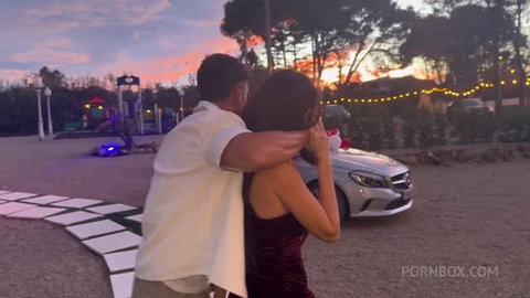 Rossa Vaxx romantic Valentine's gift embrace at sunset with luxury car