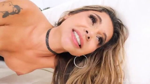 Pure Pleasure topless with choker, long wavy hair, bedroom eyes