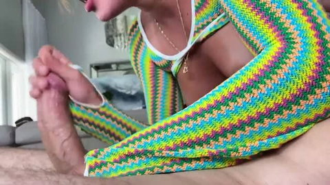 Anna Chambers in rainbow crochet outfit giving handjob to big cock