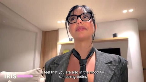Iris Rodriguez in glasses and suit ready for boss sex scene